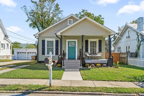 Charming front exterior w/ classic curb appeal, inviting porch, & a warm welcome from the moment you arrive.