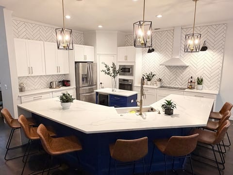 Full sized kitchen - fully decked with all your essentials. Bowls, plates, cups, utensils, carving station, pots, pans, bring sheets etc