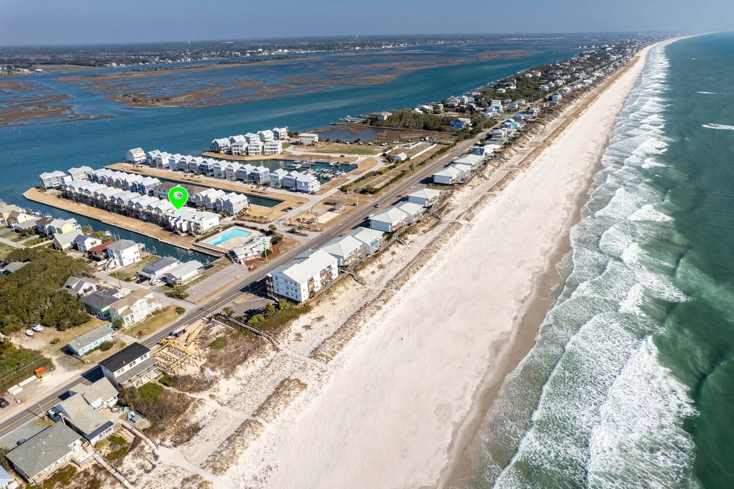 The townhouse (green marker) is on the sound and right across the street from the ocean.