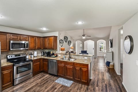 Stainless appliances, granite countertops, tile backsplash, and plenty of prep space. Plus a complimentary coffee, tea & cocoa bar to start off every morning.