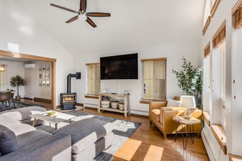 Living room with fireplace and 75" TV