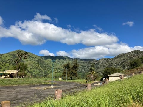 Step outside and breathe this in — every single morning. Lush green mountains, open sky, and fresh Sierra Nevada air right from your doorstep. No filter needed, no hiking required. This is the view that makes you cancel your return flight.