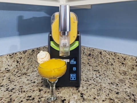 Slushie machine in the kitchen. Requires liquid with high sugar content such as soda pop - or liquid with at least 5% alcohol to turn into a delicious slushie drink.