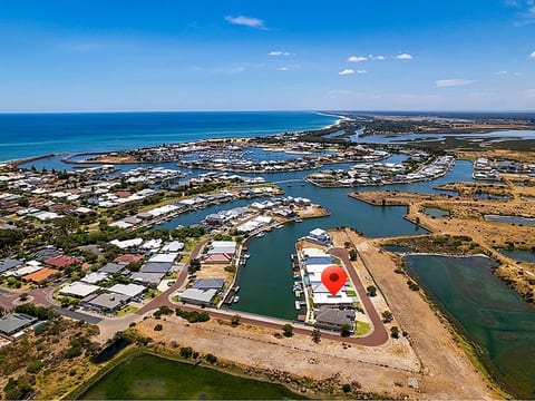 Aerial View of Our Coastal Retreat Offering Direct Marina Access and Breathtaking Sea Views - Your Perfect Getaway Awaits