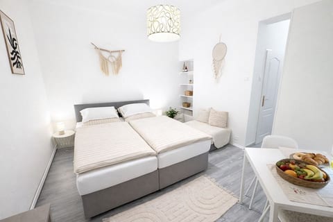 Cozy bedroom with two twin beds joined into a comfortable double setup.