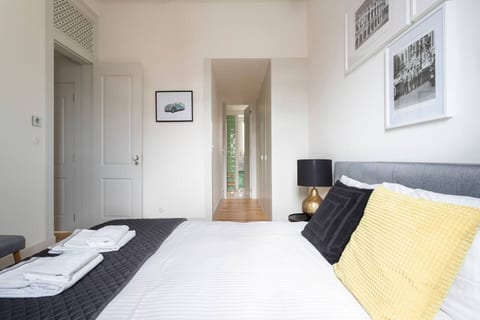 Master bedroom with a built in closet and en suite bathroom