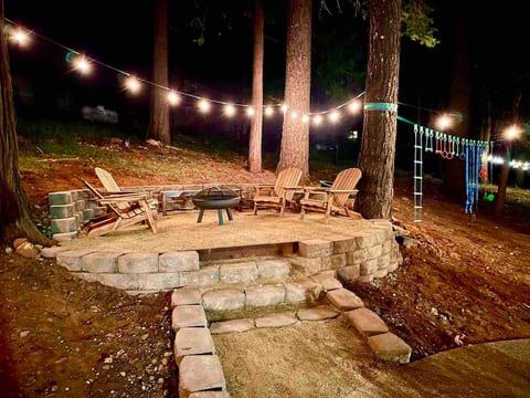 The backyard firepit w/ string lighting is the perfect setting to roast some marshmallows as you enjoy the warmth of the fire during those brisk nights