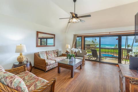 Living room; Cathedral ceilings; Sofa bed; Lanai (balcony) - view of ocean; Natural ventilation (tropical breeze).