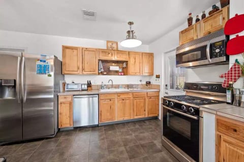 A modern, upgraded, and well-stocked kitchen with high end appliances. You will find everything you need here to cook anything up to a Thanksgiving meal.