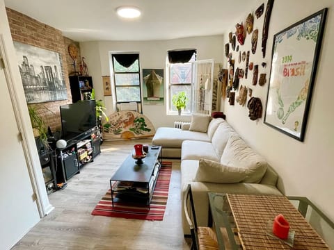 Living room with brand new, bigger sofa with chaise and dining table