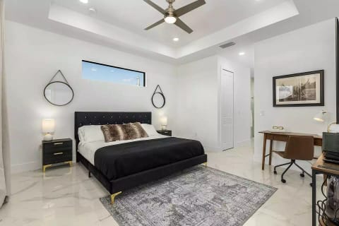 Master suite featuring a king-sized Casper bed and a dedicated work station for your convenience.