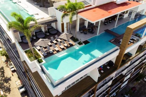 Large heated infinity edge pool, spa and swim up bar.