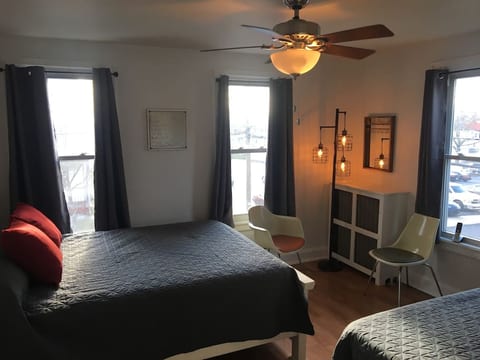 Large, open and bright front bedroom with a comfy queen pillowtop and full size memory foam bed