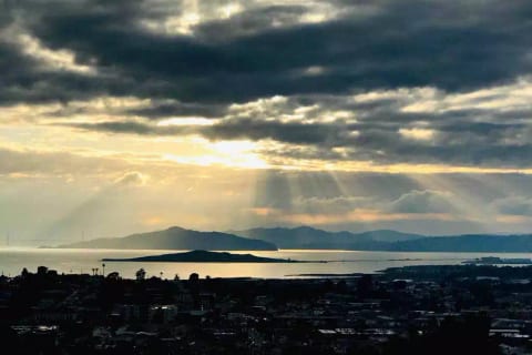 Golden Gate Bridge and San Francisco Bay at sunset from the hill just behind the cottage ( 2 min hike ); photo credit: by our Airbnb Guest Bogdan Darev