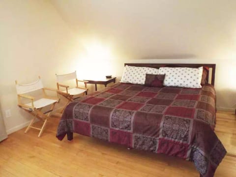 The house has three bedrooms: a master bedroom with a king-size bed; a kids' bedroom with a bunk bed (bottom bunk: double, top bunk single); and a downstairs bedroom with a double futon.