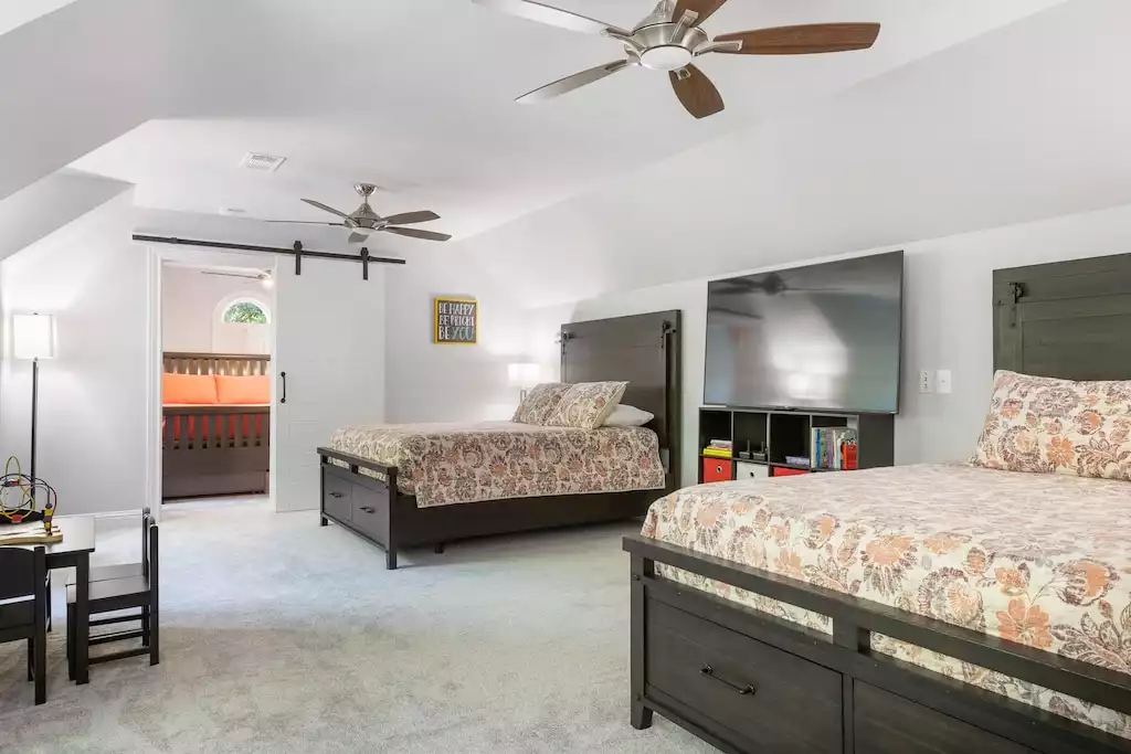 Bedroom #7 above the garage has 2 queen beds, Smart TV, games, and foosball Bedroom #7 above the garage has 2 queen beds, Smart TV, games, and foosball - Main House at Whispering Oaks Estate - Dripping Springs