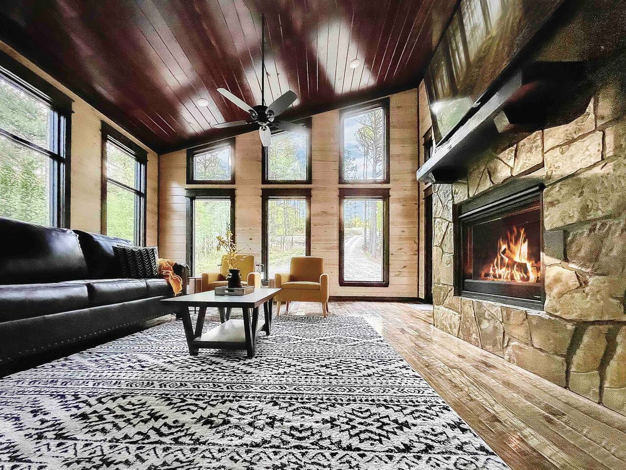 Relax in style and comfort in this spacious great room, perfect for kicking back and watching your favorite show! *Indoor fireplace is shut off between May through end of October* - Morning Primrose - Broken Bow