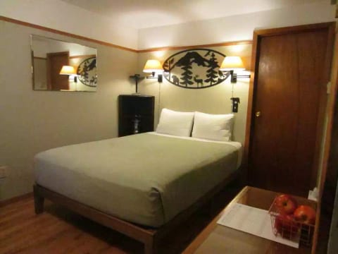 A premium bed is ready after your adventures and was planned with your rest in mind.