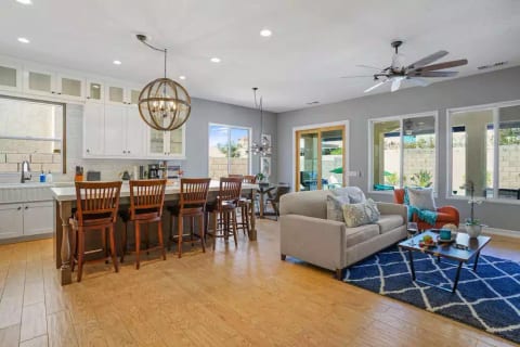 Airy spacious kitchen and "great room".. Modern Farmhouse style combines some old and some new.. like the fun "sputnik" chandelier.
