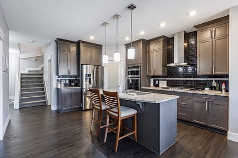 The spacious kitchen includes modern appliances and cookware. Perfect for families or longer stays.