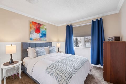 Your ultimate escape starts here! Dreamy queen bed, stunning painting, and perfect privacy with curtains & blinds.