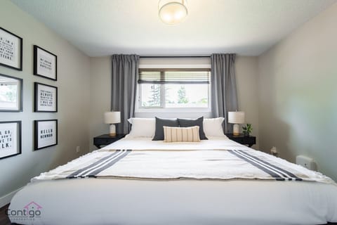 Unwind in a serene bedroom featuring a plush king-size bed, soft lighting, and minimalist decor for a restful night's sleep after exploring the city.