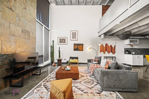 Your Urban Oasis: Chic Sofa, Smart TV (use your own subscription), and Endless Entertainment.