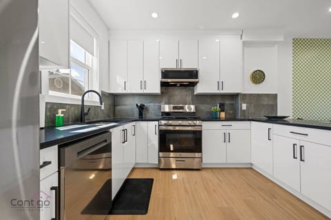 Perfect meals start here! Modern kitchen with fridge, oven, microwave, & dishwasher.