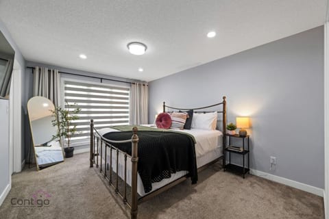 Easy access and a mirror! This ground-level double bedroom features a unique pillow for added comfort and is perfect for guests with special needs.