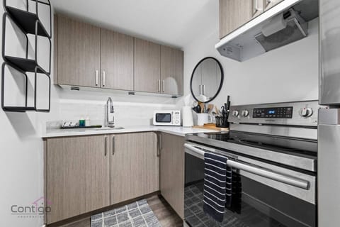 Kitchen goals! Whip up your favorite meals with our handy stove, microwave oven, and full set of utensils. Easy peasy