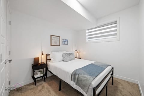 Sleep in bliss! Our snug double bed is calling, with a spacious closet for your gear, a lamp for those late-night reads, and lovely soft carpet for happy feet.