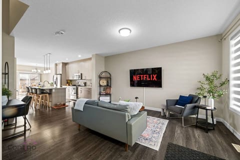 Kick back in our open and airy living space. Stream your favorites on the Smart TV (your login, please!) from plush seating, and enjoy natural light control with our blinds.