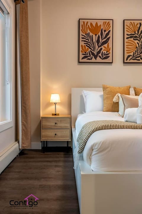 Cozy queen bedroom with blackout curtains, sleep peacefully after a day in the mountains.