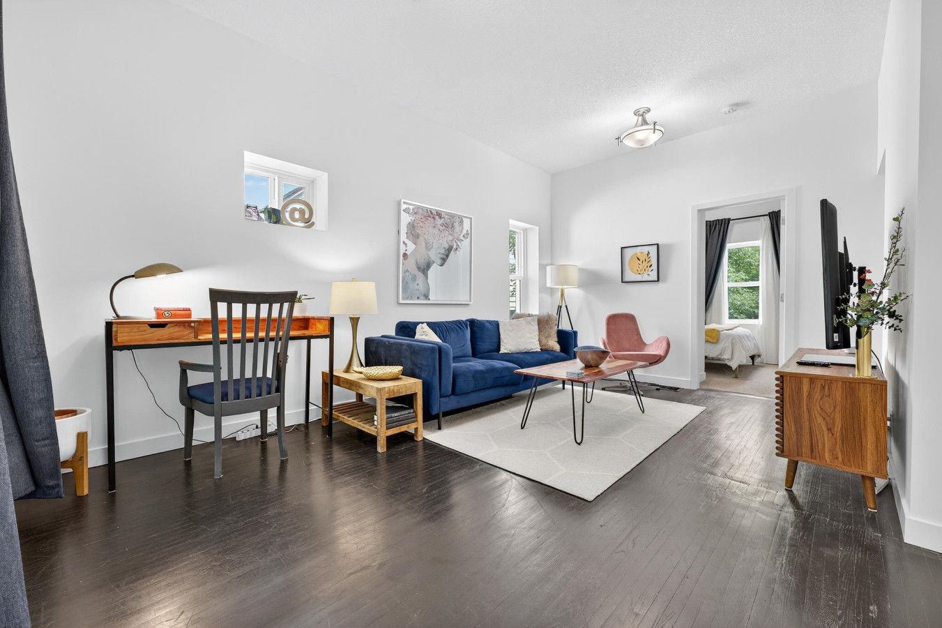 Bright and spacious living room perfect for relaxing after a day in Edmonton. Comfortable seating makes it a cozy spot to unwind.