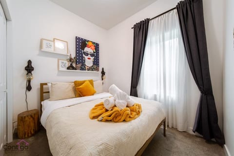 Rest easy in the queen bedroom with soft linens. Blackout curtains ensure a peaceful night’s sleep.