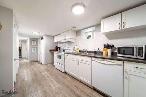 Prepare meals in a full kitchen with oven, sink, and cookware. Brew coffee or tea anytime with the included machine and kettle.
