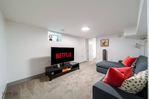 The lounge blends comfort and entertainment with a cozy sofa and smart TV. It’s the perfect spot to unwind.