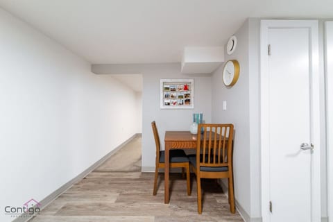 Enjoy breakfast or dinner at the dining table designed for two. A welcoming touch for cozy meals at home.
