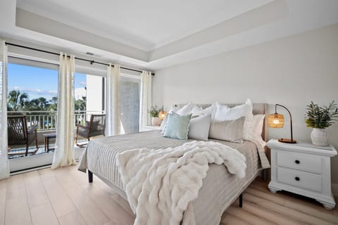 Elegant Primary Suite with Balcony Views