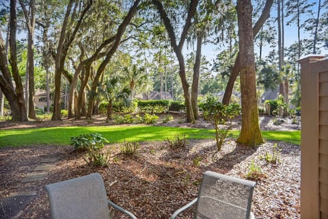 Private patio with seating just steps from the pool