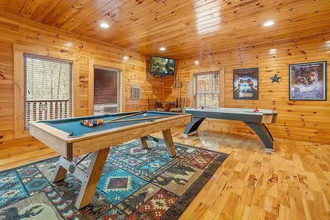 game room with pool table, air hockey, foosball, 14-in-1 arcade machine, and skee-ball!