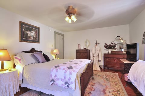 Master Bedroom with Queen sized bed, large closet, dresser, and vanity.