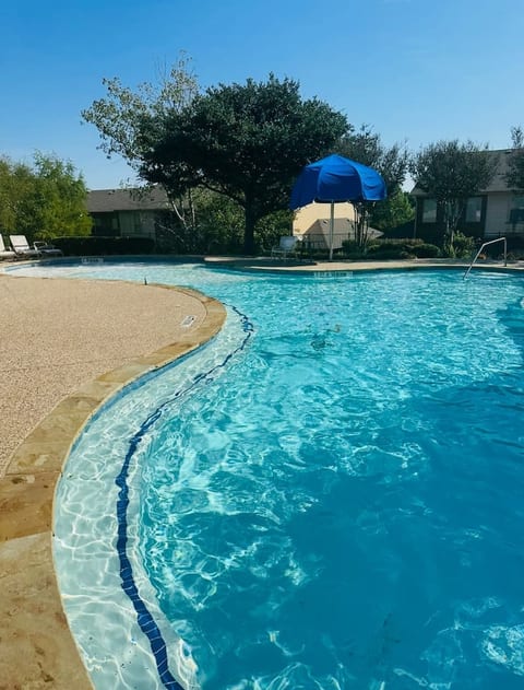 Cool off at the community pool — a welcome retreat after a hot Texas day.