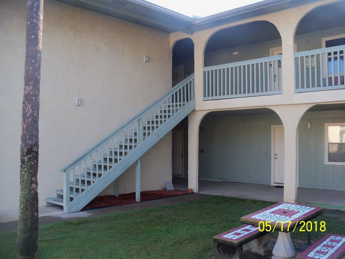 The outside stairs leading to our front door. Our condo is at the top of the stairs on the left.