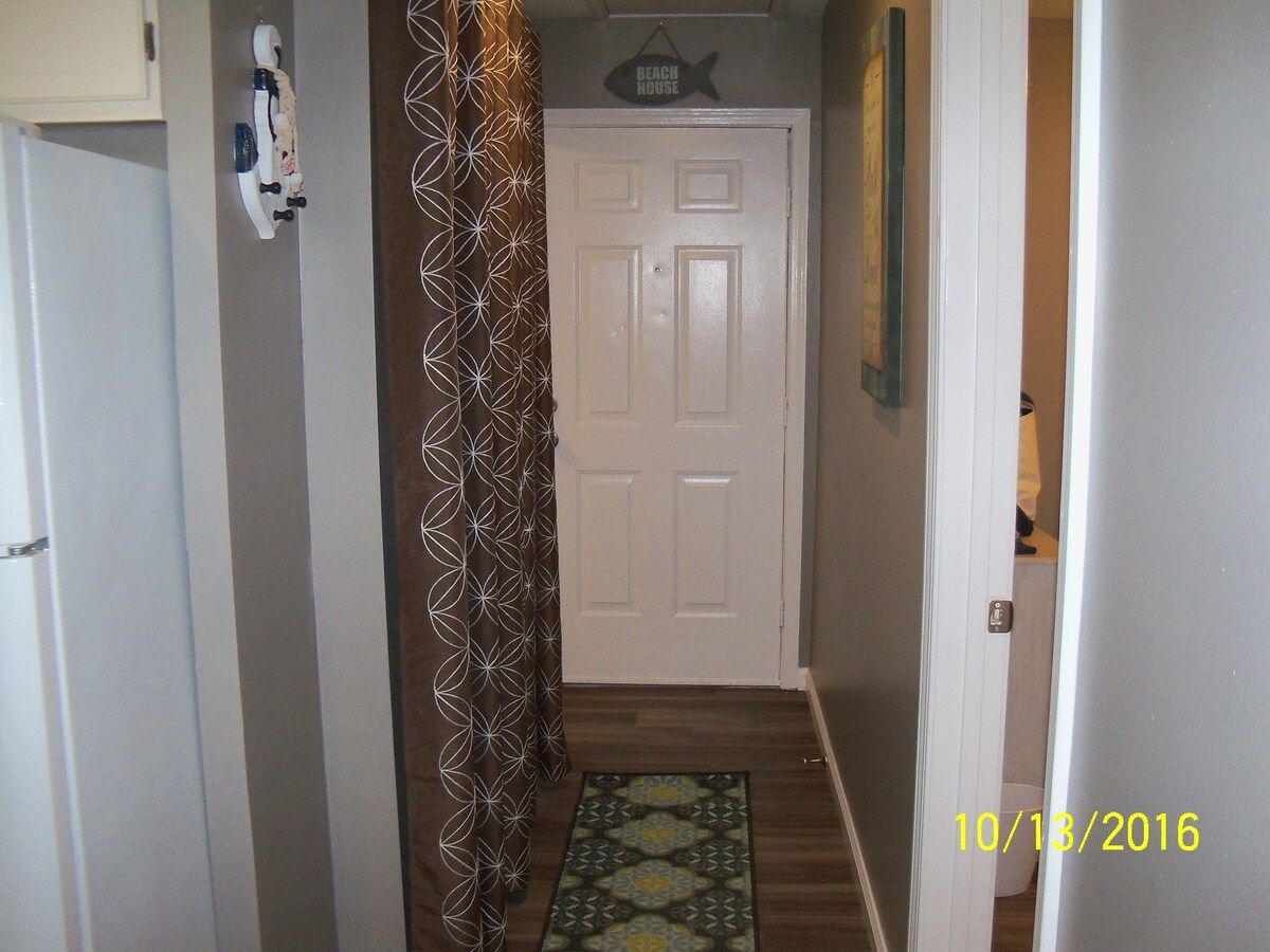 Hallway, looking towards our front door. Laundry is on the left.