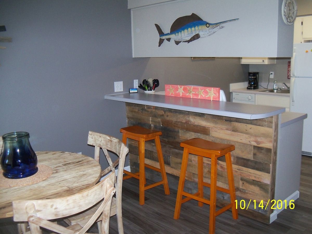 New doors, flooring, trim, lighting, beachy decor.