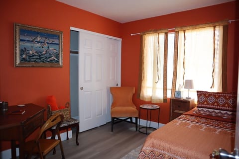 Cozy Orange Bedroom Artist Retreat Koreatown Vegas image 3