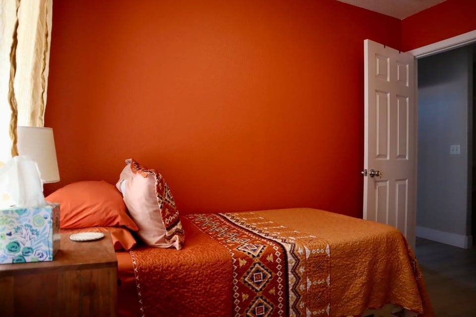Cozy Orange Bedroom Artist Retreat Koreatown Vegas image 1
