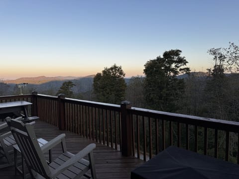 Adirondack chairs on the deck offer a peaceful spot to take in the mountain views at dusk.