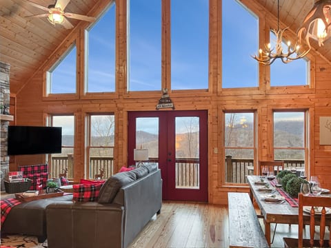Vaulted ceilings and a wall of windows fill the great room with natural light and mountain views.